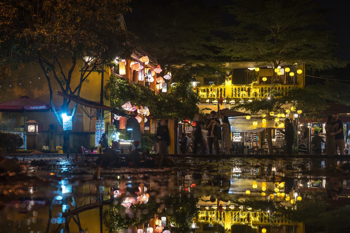 Lanterns over the old town waterfront at night, Hoi An