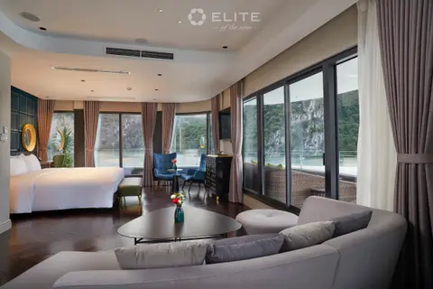 President suite seating area with a sofa and armchairs turned towards the bay windows